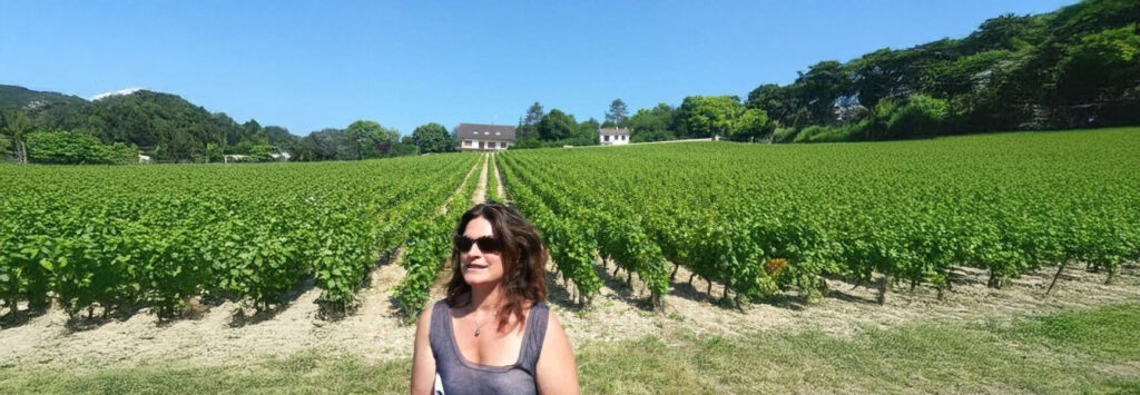 Marie Tesson CEO of Journeys of a lifetime in the middle of Burgundy Vines