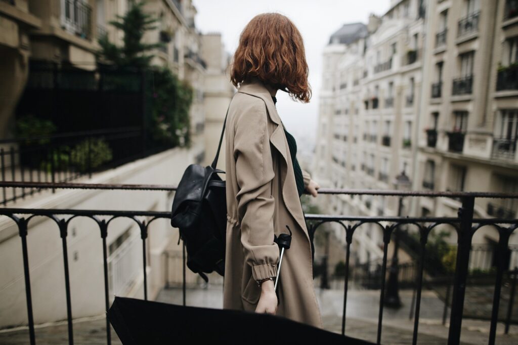 Girl looking at the street in Paris