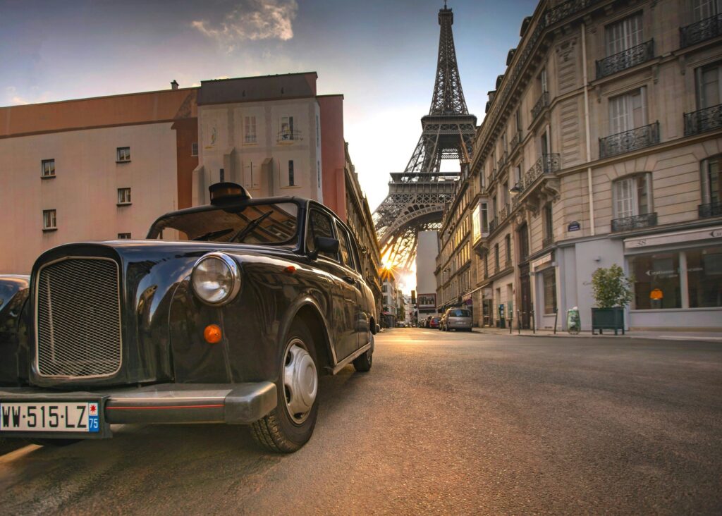 View of a classic car with the Eiffel Tower on the background